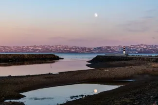 The full moon in Annijoki over the Varangerfjord to the Barents Sea