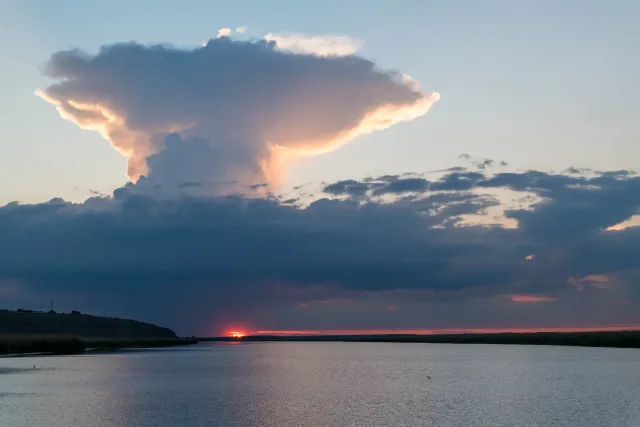 Cumulonimbus or anvil cloud over sunset in the Danube Delta